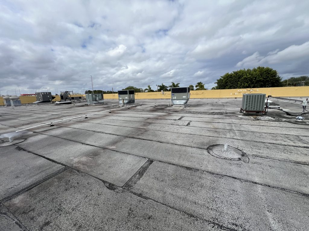 Initial site inspection to evaluate the rooftop conditions for future equipment installation.
